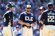 Manager Stephen Vogt (center) has a decision to make on the Guardians' starting rotation.