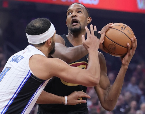 Cleveland Cavaliers forward Evan Mobley works his offense on Orlando Magic guard Jalen Suggs