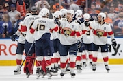 Florida Panthers players celebrate their win over the Edmonton Oilers in Game 3 of the NHL hockey Stanley Cup Finals, Thursday, June 13, 2024, in Edmonton, Alberta. (Jason Franson/The Canadian Press via AP)