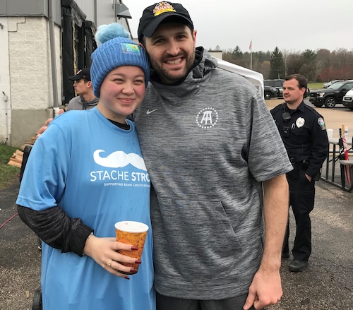 Bunny Oldham and Pete Meadows, on the sidelines of the Meadows Turkey Bowl. In the past several years, both have been diagnosed with different forms of brain cancer. Part of the proceeds from the annual Thanksgiving charity football game in Hinckley goes to fund research to fight brain cancer.
