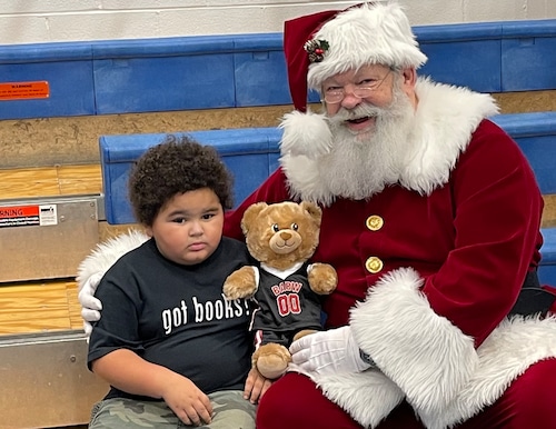 Little boy with Santa and a teddy bear