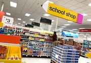 A worker stocks shelves of back-to-school supplies at a Target store on August 03, 2020 in Colma, California. In the midst of the ongoing coronavirus pandemic, back-to-school shopping has mostly moved to online sales, with purchases shifting from clothing to laptop computers and home schooling supplies. (Photo by Justin Sullivan/Getty Images)
