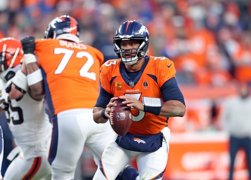 Denver Broncos quarterback Russell Wilson looks to throw against the Cleveland Browns in the second half at Empower Field at Mile High.