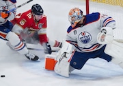 Edmonton Oilers goaltender Stuart Skinner (74) makes a save against the Panthers' Aleksander Barkov. Stuart and the Oilers will try to get back into the series tonight when they host Game 3 in Edmonton.