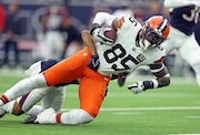 Cleveland Browns tight end David Njoku turns upfield after a reception tackled by Houston Texans cornerback Steven Nelson in the first half.  