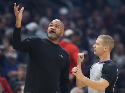 Cleveland Cavaliers head coach J.B. Bickerstaff confers with official Tyler Ford on a non foul call in the first half