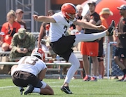 Cleveland Browns place kicker Cade York kicks a field gaol attempt with holder Corey Bojorquez during training camp, August 22, 2023, in Berea. 