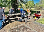 Members from Greene Acres' construction and maintenance team assemble the group's new 8-foot-long picnic table. Team members include Rich Mendala, Dave Lenigan, Ed Thompson, John Nixon, John Goshorn and Larry Latine.