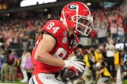 Georgia wide receiver Ladd McConkey (84) lands in the end zoneafter a catch for a touchdown against TCU during the first half of the national championship NCAA College Football Playoff game, Monday, Jan. 9, 2023, in Inglewood, Calif. (AP Photo/Mark J. Terrill)