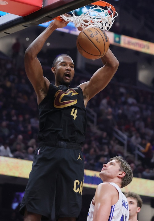 Cleveland Cavaliers forward Evan Mobley dunks the ball for a score defended by Orlando Magic center Moritz Wagner