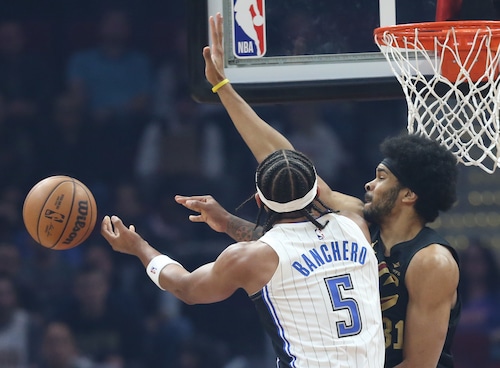 Orlando Magic forward Paolo Banchero loses control of the basketball for a turnover guarded by Cleveland Cavaliers center Jarrett Allen in the first half