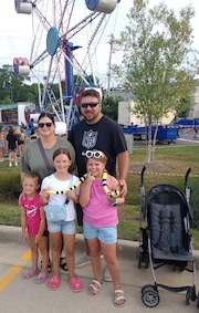 Brunswick residents Brooke and Eddy Janczewski - with their kids Frankie and Alex and friend Eva Bertke - enjoyed the food, games and especially the rides at the St. Ambrose Summer Festival June 20.