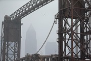 Key Tower, seen through a lift bridge at Wendy Park, is mostly obscured from driving snow  in Cleveland. 