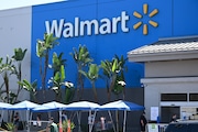 People wearing face coverings wait in line to shop at Walmart, July 22, 2020 in Burbank, California. - The country's most populous state reported a record 12,807 new coronavirus infections in the past 24 hours. (Photo by Robyn Beck / AFP) (Photo by ROBYN BECK/AFP via Getty Images)