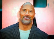 Dwayne "The Rock" Johnson is now part-owner of the XFL. (Photo by Vianney Le Caer/Invision/AP, File)