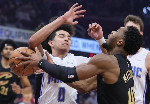 Cleveland Cavaliers guard Donovan Mitchell loses control of the basketball from the defense of Orlando Magic guard Anthony Black