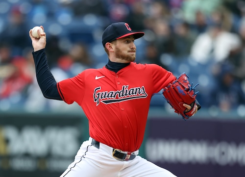 Cleveland Guardians starting pitcher Tanner Bibee pitches against the Oakland Athletics in the first inning.