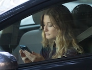 A driver uses her mobile phone while sitting in traffic Wednesday, June 22, 2016, in Sacramento, Calif. The number of California drivers using cellphones is rising, as are deaths and injuries blamed on distracted driving, the California Office of Traffic Safety reported Wednesday, June 22, 2016. Meanwhile the numbers of tickets issued by the California Highway Patrol has substantially declined. (AP Photo/Rich Pedroncelli)