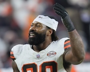 Cleveland Browns defensive end Za'Darius Smith celebrates with fans over their win against the New York Jets at Cleveland Browns Stadium. 