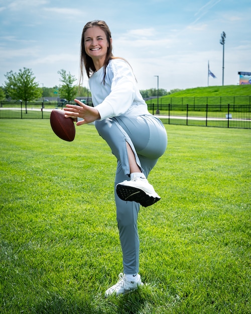 Woman getting ready to throw a football