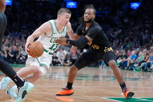 Boston Celtics guard Payton Pritchard (11) drives toward the basket as Cleveland Cavaliers guard Darius Garland (10) defends during the first half of Game 2 of an NBA basketball second-round playoff series Thursday, May 9, 2024, in Boston. (AP Photo/Steven Senne)