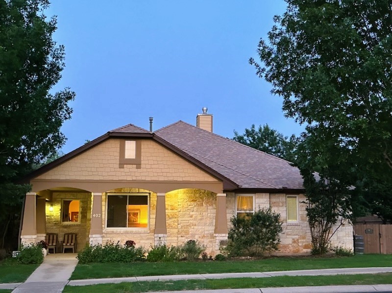 a front view of a house with a yard