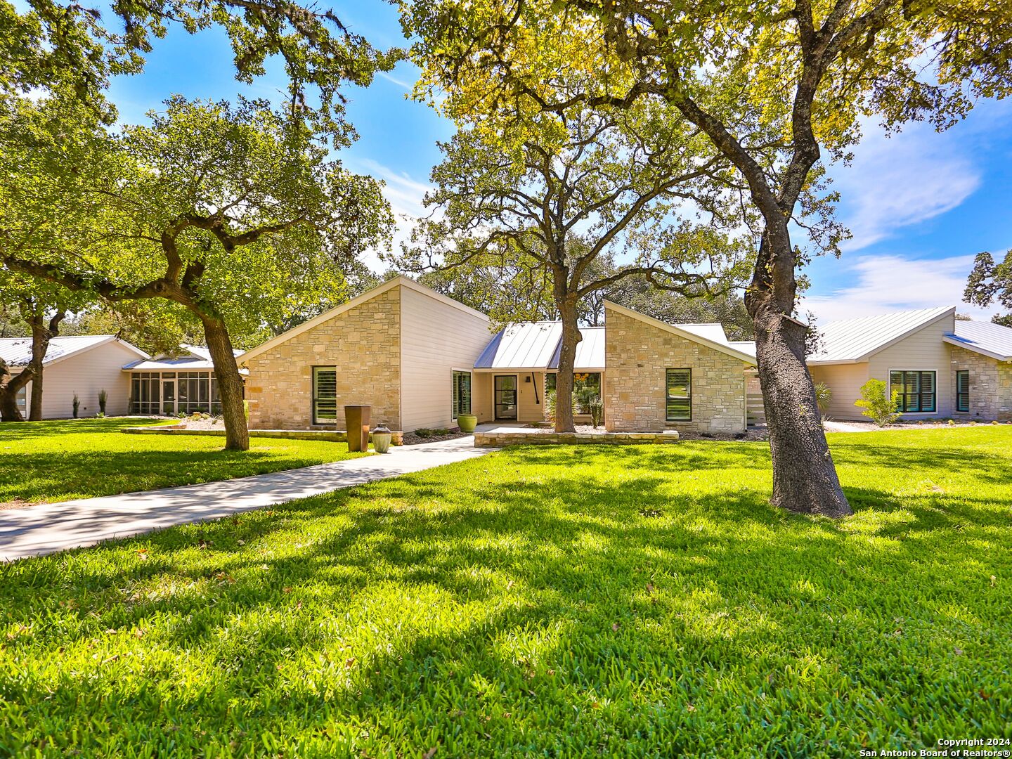 a view of a house with pool and tree s