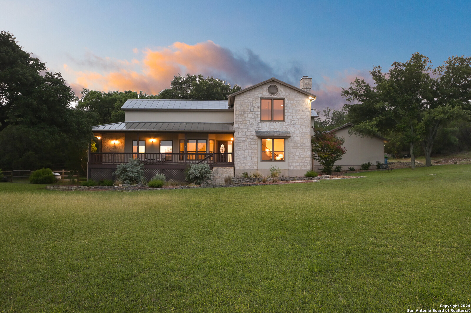 a front view of house with yard and green space