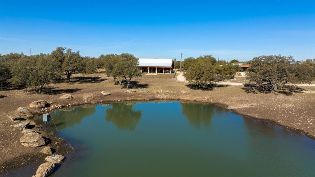 a view of a lake with houses in the background