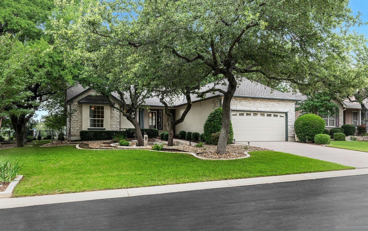 a front view of house with yard and green space