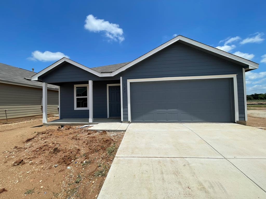 a front view of a house with yard