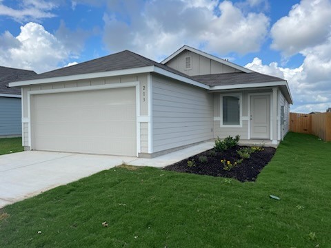 a front view of house with yard and green space