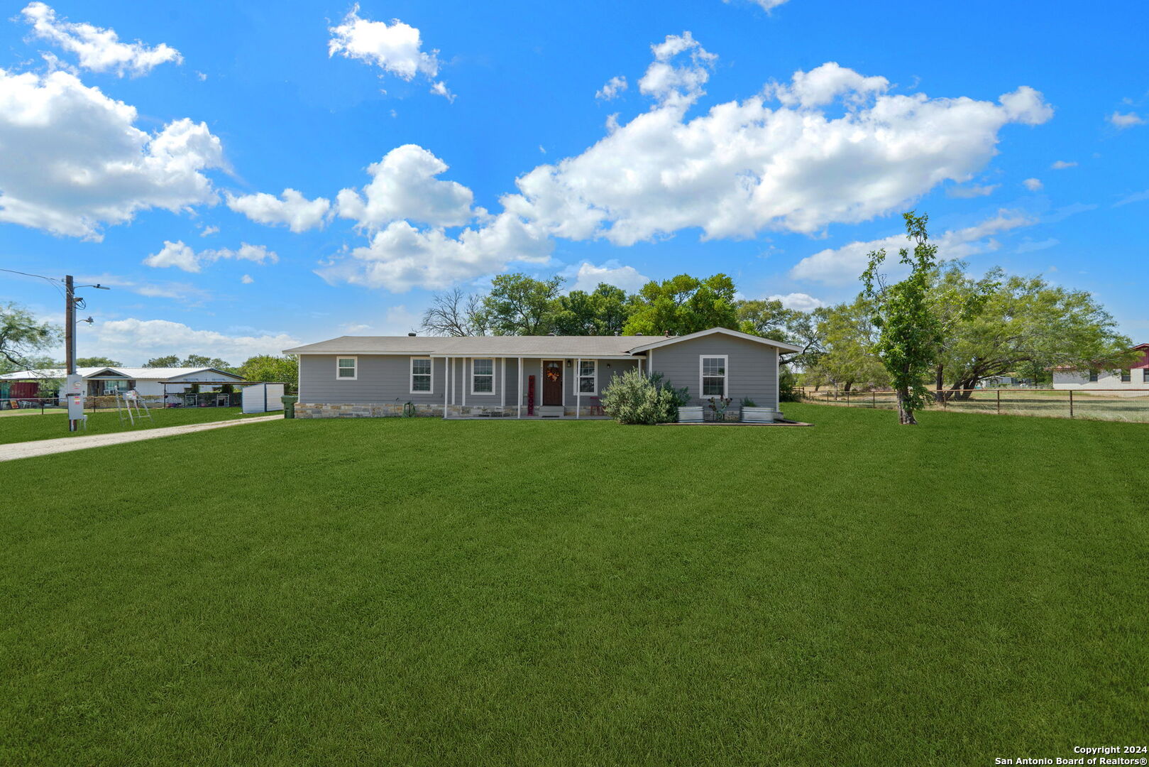 a view of a house with a big yard