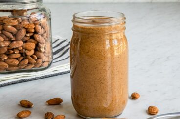 Almond butter in a clear jar.