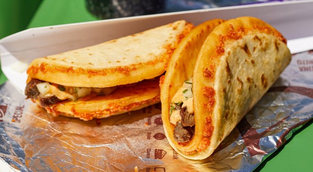 The new item from Irvine's fast food giant features steak or chicken in a cheesy shell. 
