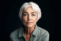 Woman in front of black background