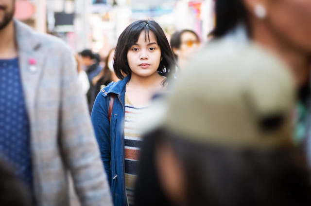 Woman walking in crowd