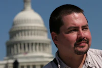 Man in front of capitol building