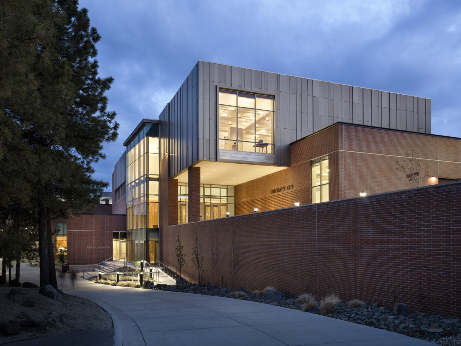 Exterior view of the University of Nevada, Reno University Arts Building lit in the evening