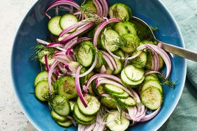 Cucumber vinegar salad in a blue bowl