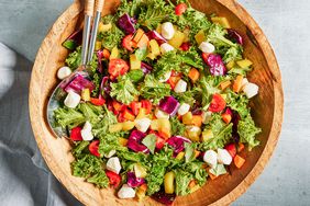 Overhead view of a wooden serving bowl of Eat-the-Rainbow Chopped Salad with Basil & Mozzarella recipe