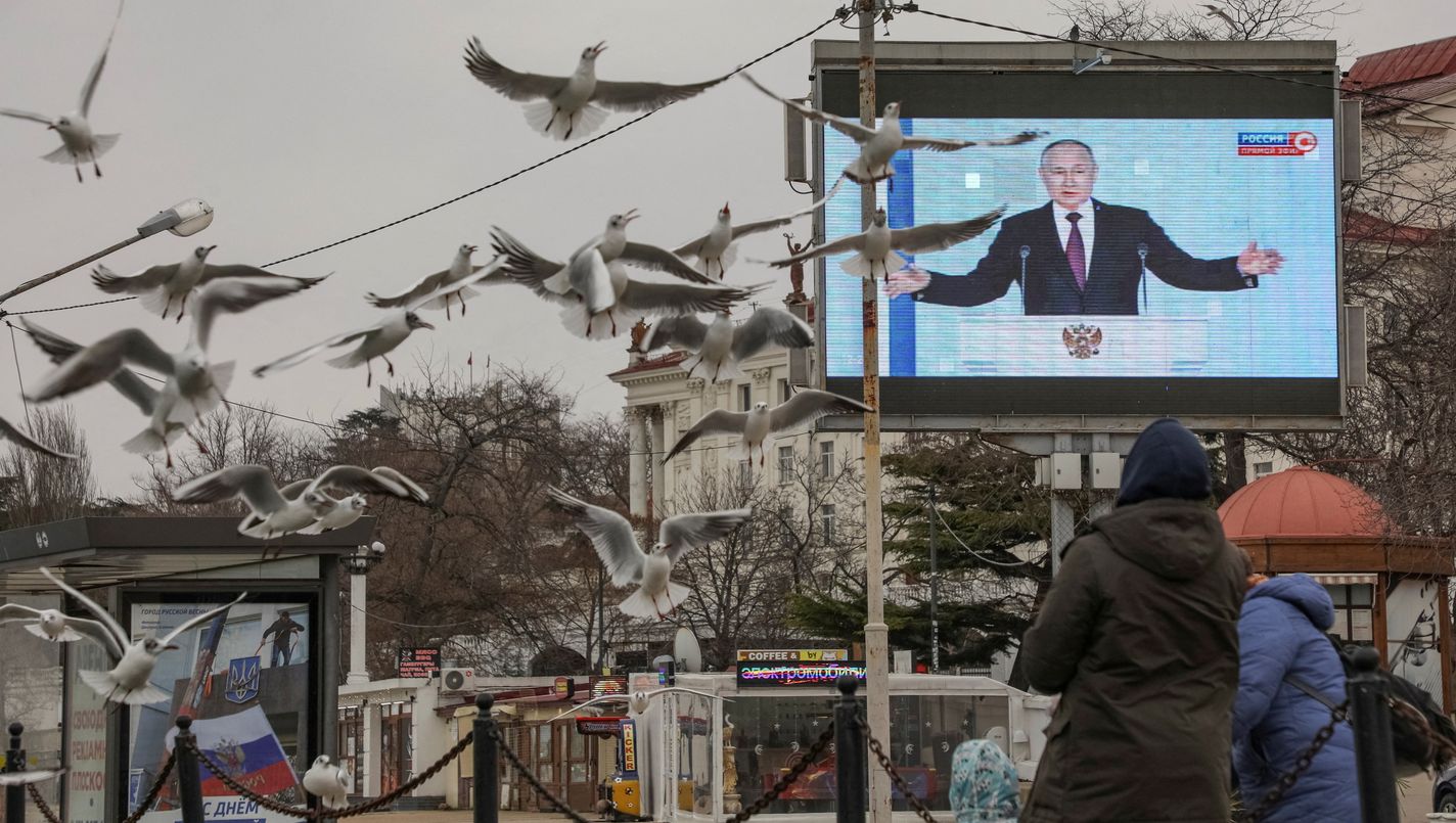 Russian President Vladimir Putin is seen on a screen during his annual address to the Federal Assembly, in Sevastopol, Crimea February 21, 2023.  REUTERS/Alexey Pavlishak     TPX IMAGES OF THE DAY     