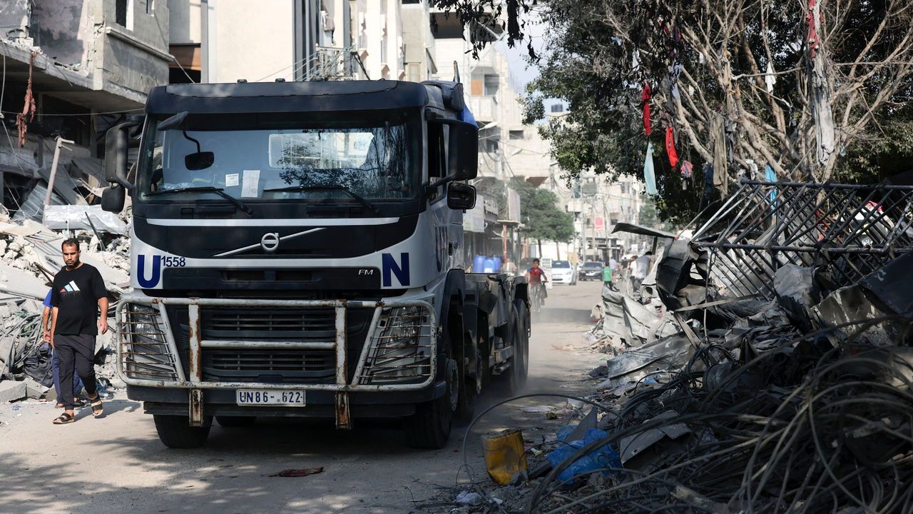 A United Nations truck drives through a street ravaged by Israeli bombing  in Rafah in the souther Gaza Strip.