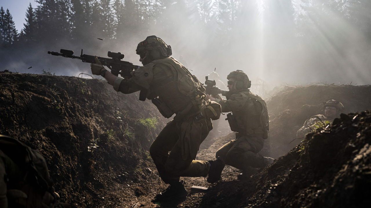 Norwegian instructors participate in a blank fire exercise with Ukrainian soldiers.