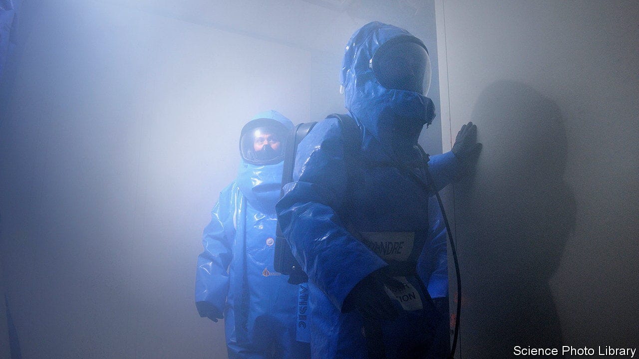 Hazardous materials training for policemen, France. Officers of the Gendarmerie Nationale being trained in protective hazmat (hazardous materials) suits. This training is preparing the officers for situations where biological or chemical weapons may have been used.