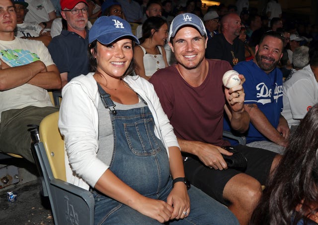 Robbie Amell and Italia Ricci at dodgers game
