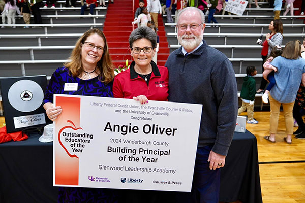 Angie Oliver holding sign