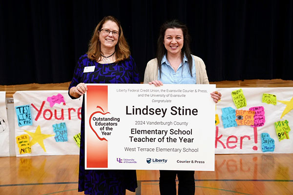 Winners holding sign