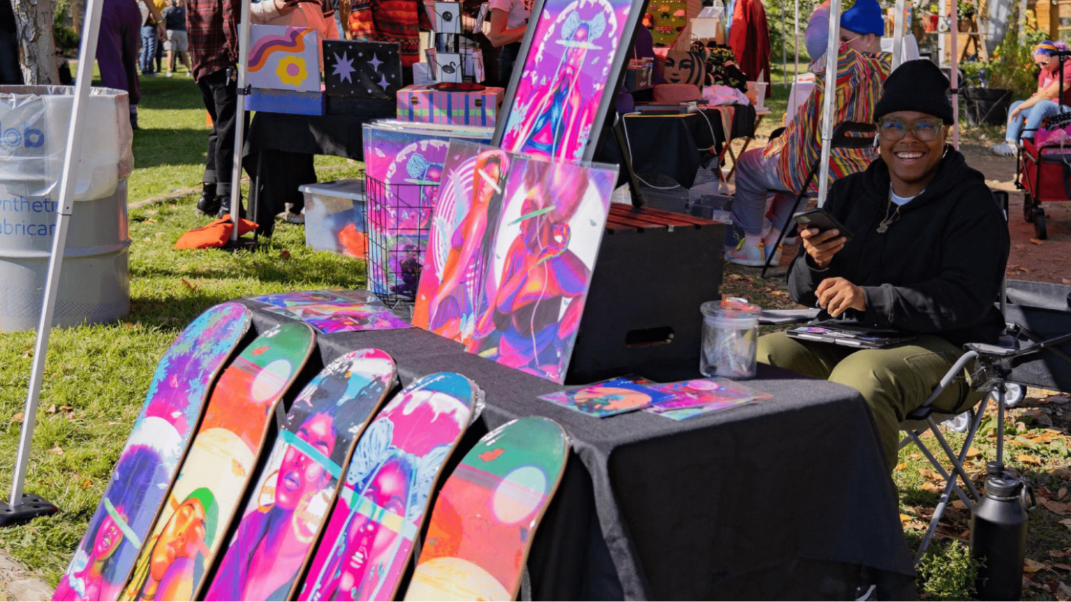 booth owner selling skateboards