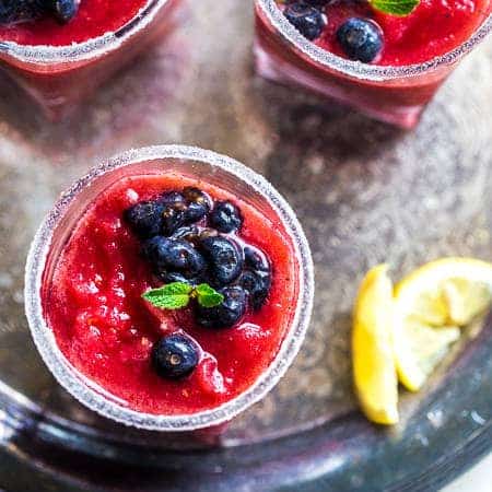 Skinny Blended Lemon Raspberry Mojito with Muddled Blueberries - Thick, frosty and SO refreshing for only 115 calories! Skinny summer drinking at it's best! | Foodfaithfitness.com | @FoodFaithFit